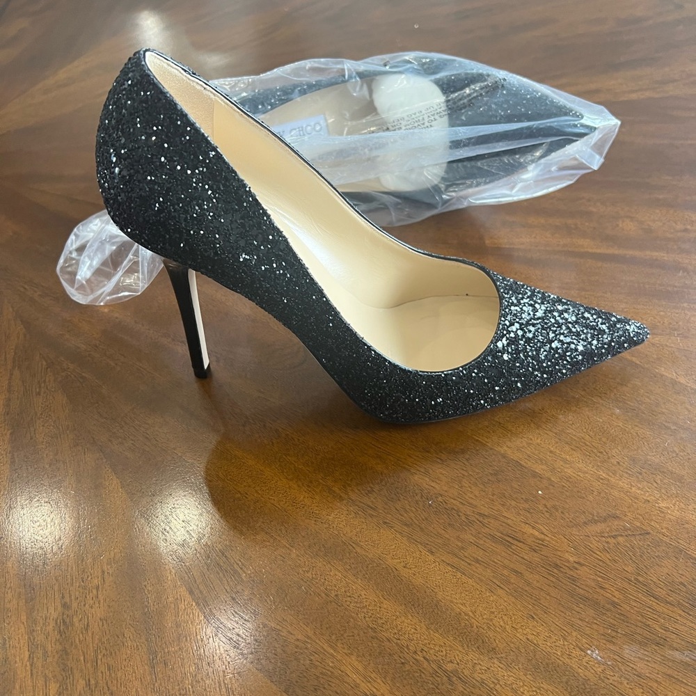 Jimmy Choo black glitter heels.